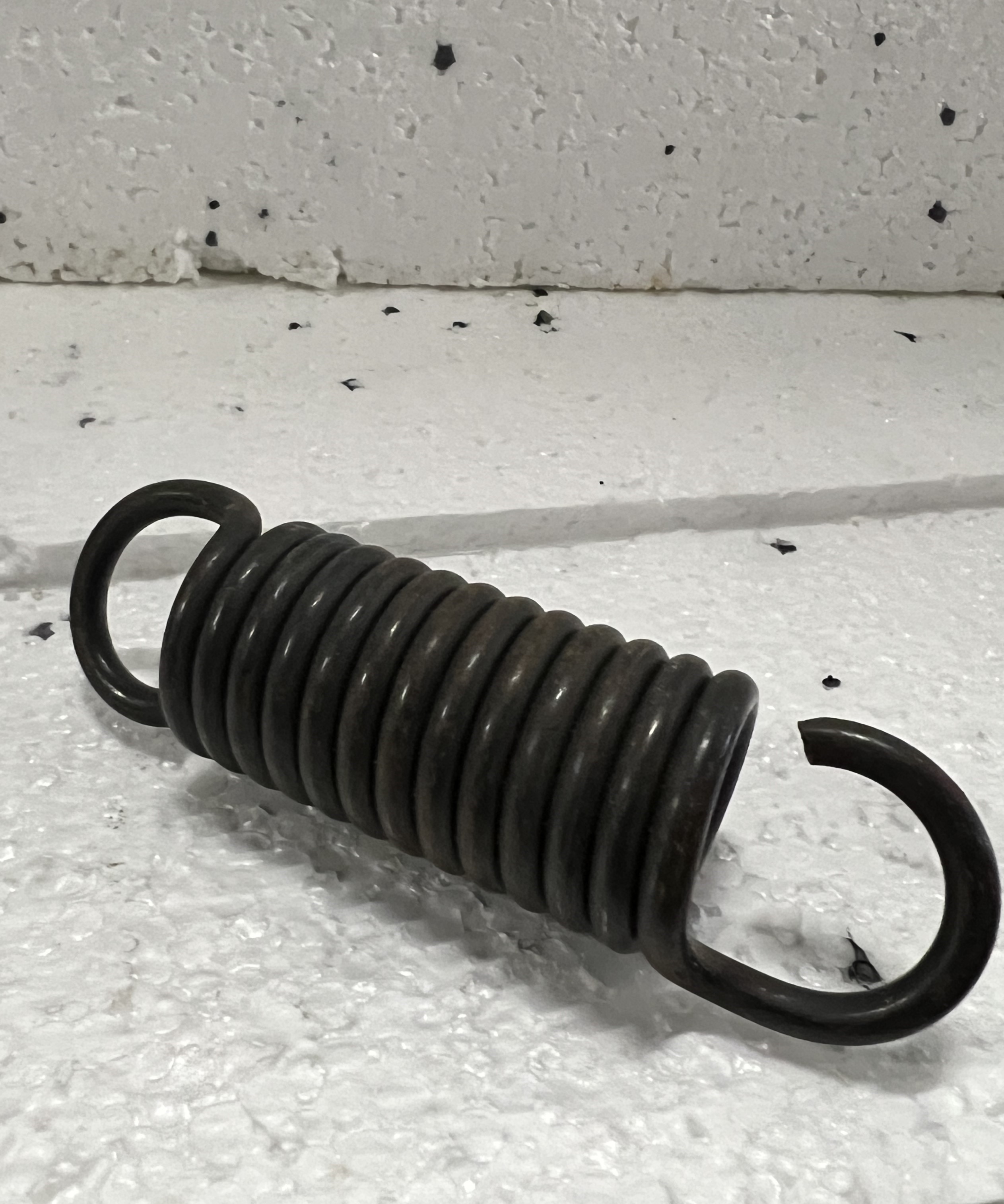 Пружина оттяжная тормозных колодок 582.90-3141-045  